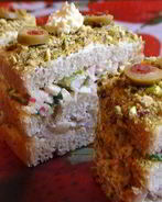 Закусочные тортики с сельдью и крабовыми палочками